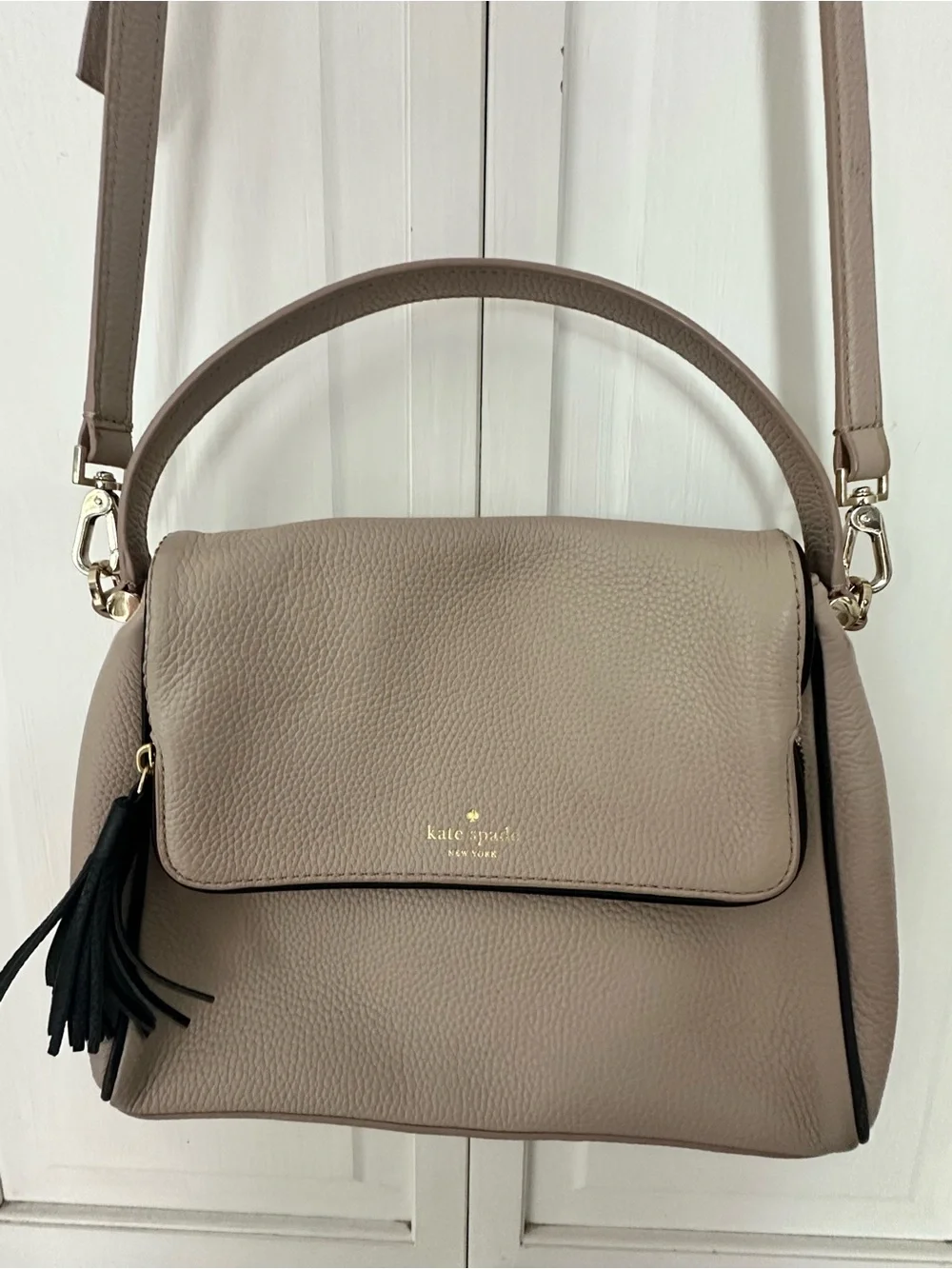 kate spade taupe pebbled leather shoulder bag with black tassel